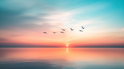Obraz premium A serene sunset over calm waters with birds flying in formation against a colorful sky.