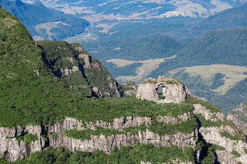 Photo of iconic holed stone in the middle of São Joaquim National Park, in Urubici, state of Santa Catarina, Brazil.