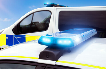 Police car lights - flashing emergency services siren from police vehicle lightbar. Used in pursuit or response at the scene of an incident. Officers enforce law and order and protect the public © Lawrey