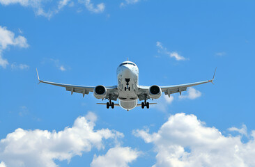 Obraz premium Airplane on blue sky white clouds