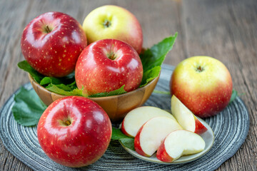 Fresh Red Japanese Apple in wooden bowl on wooden background, Red Apple in wooden basket.