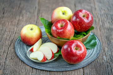 Fresh Red Japanese Apple in wooden bowl on wooden background, Red Apple in wooden basket.