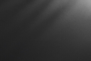 Abstract dark textured black background with a soft shadow gradient, ideal for backgrounds, designs, or overlay.
