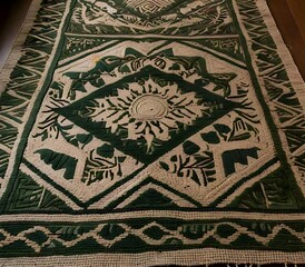 Intricately Textured Beige Rug in Minimalist Living Space