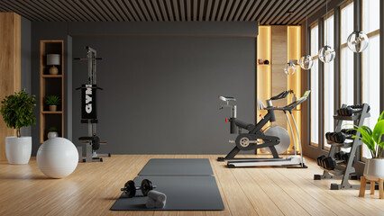 Modern gym interior with sport and fitness equipment on black wall background- 3D rendering
