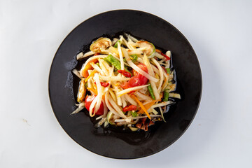 Som Tum Thai - Papaya Salad on a white background