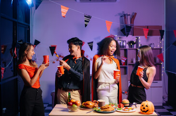 Halloween party with friends in costumes, enjoying drinks, food, and festive decorations. Perfect...