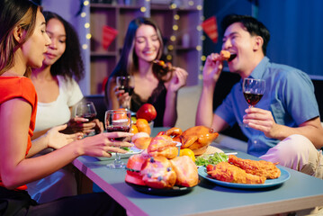 Celebration with friends enjoying food, drinks, and laughter at a lively house party. Perfect for themes of joy, togetherness,