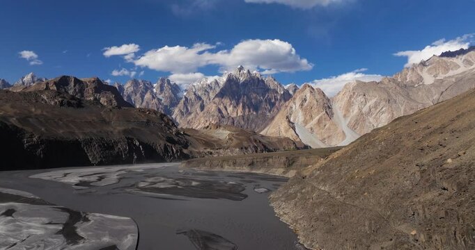 Drone Flying Away from Beautiful Passu Cones Mountains, Hunza River. Pakistan