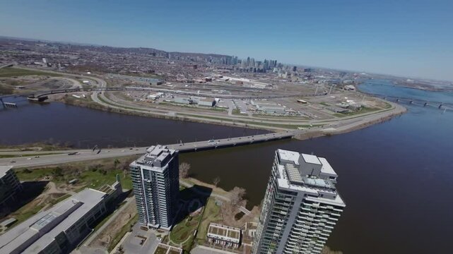 Residential Towers Overlooking Champlain Bridge Over Saint Lawrence River In Nuns' Island, Montreal Canada. Aerial Drone Shot
