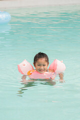 Girl playing in the pool