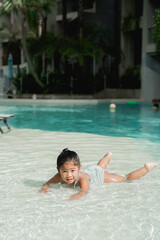 Girl playing in the pool