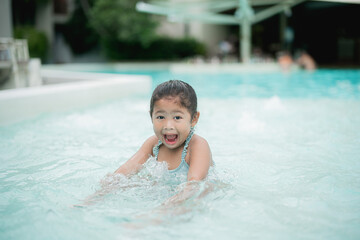 Girl playing in the pool