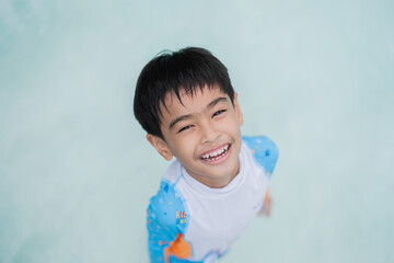 boy playing in the pool
