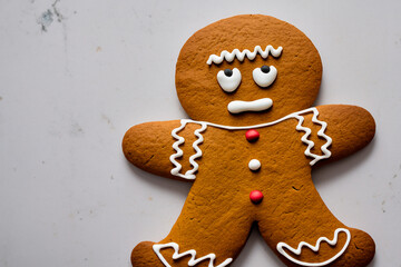 worried gingerbread man cookie on white background