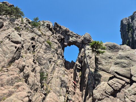 gigantic hole in the granite rock at Bocca di Velaco, Trou de la Bombe, at Conca, Sart&egrave;ne, 