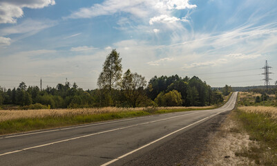 A road with a few trees in the background