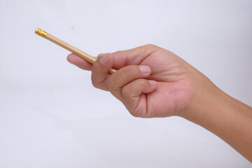Someone pointing at something using pencil in the hand