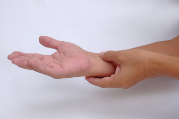 A pair of hands checking the pulse of the blood pressure