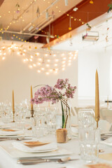 Spring wedding decor with purple lilac centre pieces