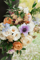 Spring wedding bouquet with pastels purples and oranges
