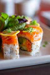 Close-up of colorful sushi roll on plate vertical © Cavan