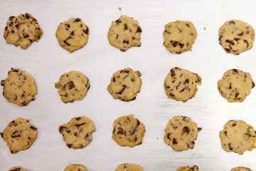 raw cookie dough divided into small cookies ready to bake