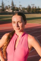 Upclose shot of female athlete standing on track