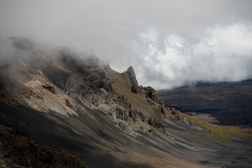 View of Haleakala volcano crater hillside  with fog and cloud cover