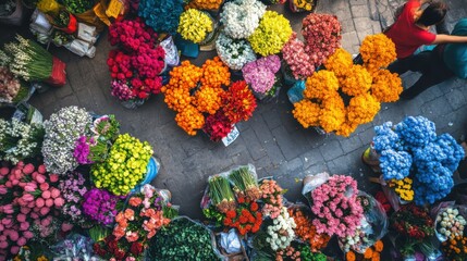 Overhead shot of a bustling flower market with a variety of vibrant bouquets in every color