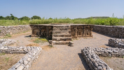 Front view of ancient double-headed eagle stupa in ruins of Sirkap, Taxila, Punjab, Pakistan, UNESCO World Heritage site