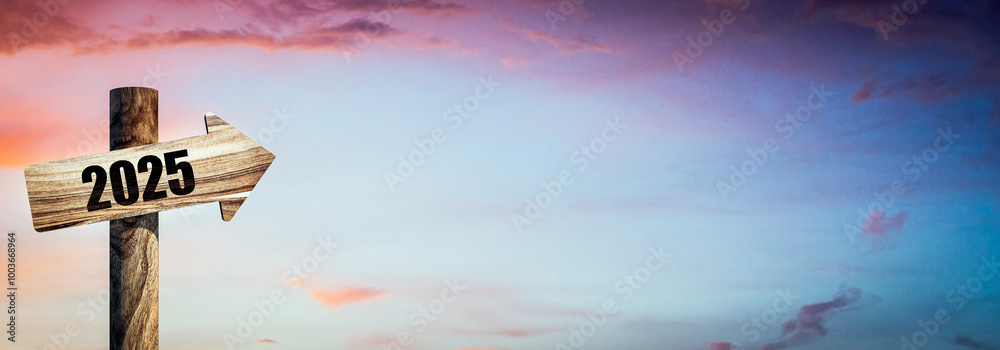 Aufkleber wooden 2025 year sign or guidepost on beautiful wide sunset background with mock up place. future co