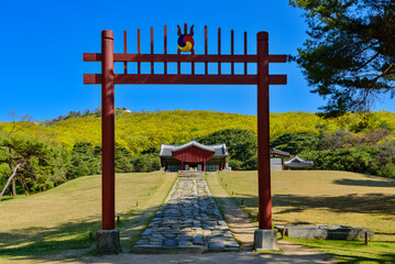 Jangneung Royal Tomb, Gimpo-si, Gyeonggi-do, South Korea - April 26, 2020: Hongsalmun(a red gate with spiked top) and Jeongjagag(T-shaped house for sacrifice before a royal tomb)
