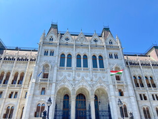 Fototapeta premium The impressive medieval architectural beauty of the ensemble of buildings of the Hungarian Parliament will not leave any viewer indifferent.