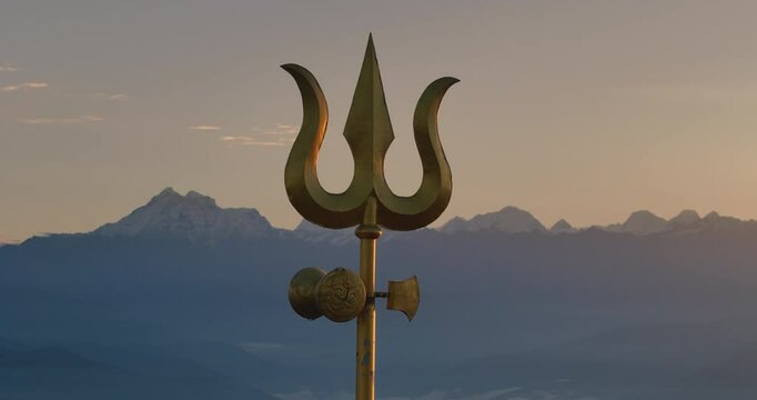 Drone shot of Lord Shiva's Trishul in Nepal during sunrise sunrays illuminate trident on a hillside of Shailung Dolakha near Tibet powerful scene of mountain ranges horizon with holy Kailash Parbat
