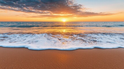 Fototapeta premium The ocean is calm and the sun is setting, creating a beautiful