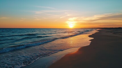 Obraz premium The ocean is calm and the sun is setting, creating a beautiful