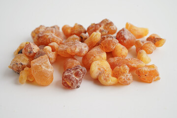 Frankincense or olibanum aromatic resin isolated on white background used in incense and perfumes.