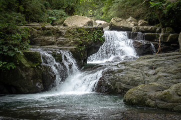 River goes like stair from the beautiful shape rocks, hidden in the forest, in Manyueyuan Forest Recreation Area, New Taipei City, Taiwan.
