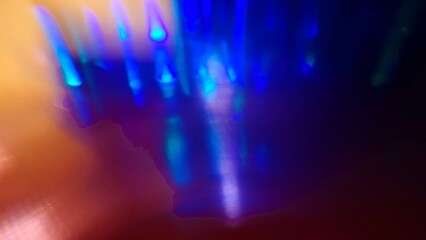 Blue bokeh light effect against a dark background. The speed of light creates beautiful compositions.