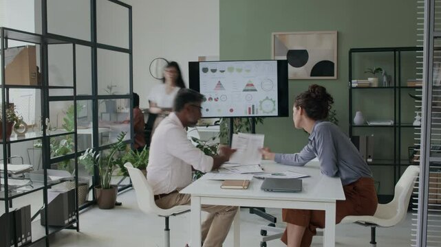 Time lapse of diverse colleagues meeting at office to discuss tasks