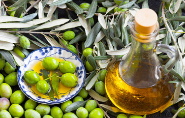 Image of raw olives and liquid form of raw olives.