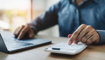 close up young man hand press on calculator to check and summary expense of home loan mortgage 