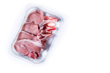 Fresh packaged pork chops isolated on white background. Top view. Copy space
