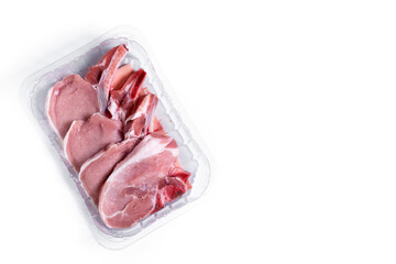 Fresh packaged pork chops isolated on white background. Top view. Copy space