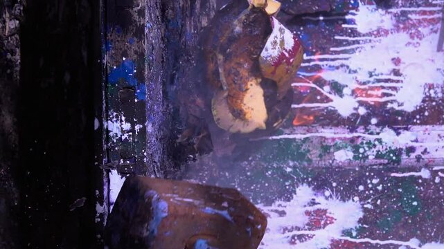 slow motion video art scary Halloween pumpkins and smashing with a heavy big hammer smoke and fire preparing for a celebration in a scary place