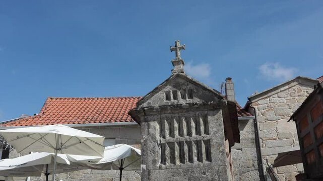 Traditional Spanish h&oacute;rreos under a clear blue sky in Combarro, Pontevedra, Galicia