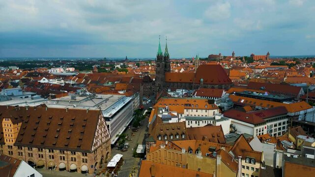 4K Aerial Drone Video of Copper-clad Spiers and Tiled Roof of St. Lawrence Church in Downtown Nurnberg, Germany