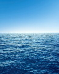 Obraz premium A calm blue seascape with a clear sky and soft clouds
