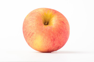 Fresh ripe apple with tiny water drops on white background